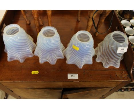 Four Vaseline glass lamp shades 
