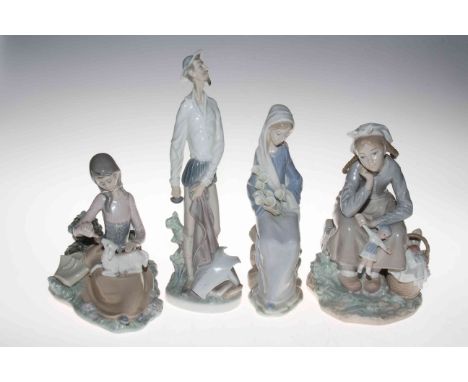 Collection of four Lladro figures.