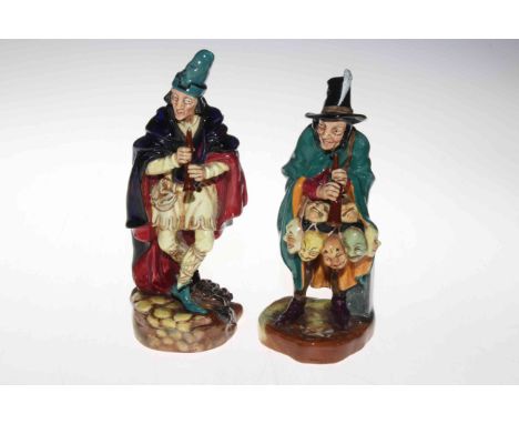 Two Royal Doulton figures, The Mask Sellar and The Pied Piper.