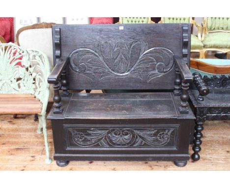 Carved oak monks bench.