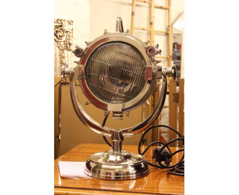 Industrial design desk lamp in chrome finish.
