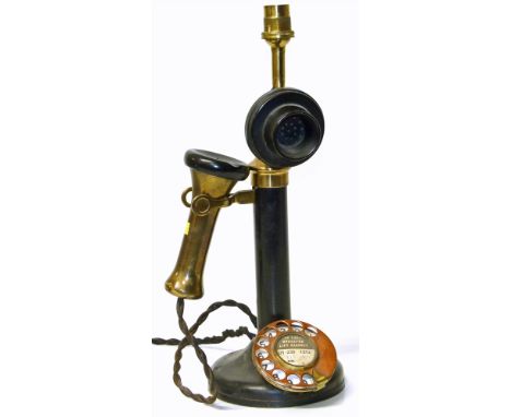 Brass/copper/Bakalite candlestick telephone converted to table lamp. Condition reports are not available for the Interiors Sa