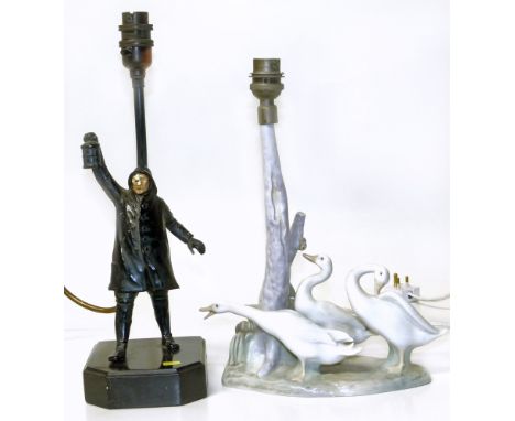 Table lamp base in the form of a night watchman and Lladro table lamp. Condition reports are not available for the Interiors 