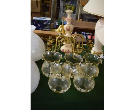 A Brass and Ceramic Five Branch Ceiling Chandelier 