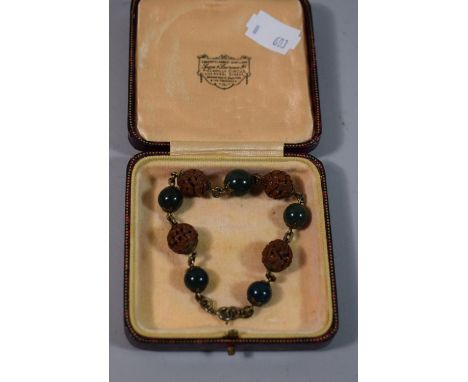 A Carved and Jade Bracelet 