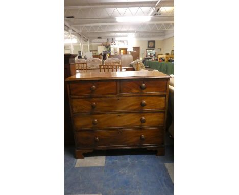 A Victorian Mahogany Bedroom Chest of Two Short and Three Long Drawers with Turned Wooden Handles. One Bracket Foot Requires 