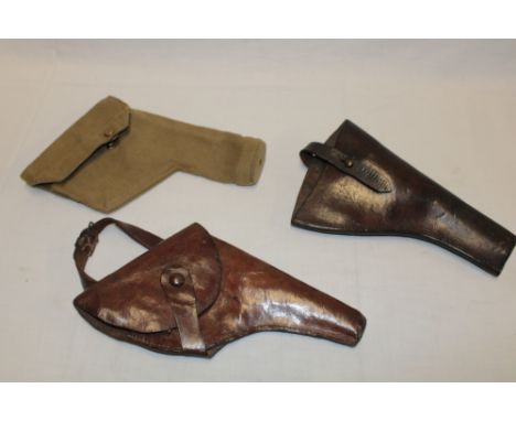 Two First War leather revolver holsters and a Second War webbing holster dated 1943 (3)
