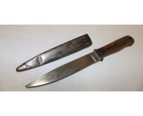 A First War German fighting knife with 6" single edged blade and plain wood grips in steel scabbard with belt clip