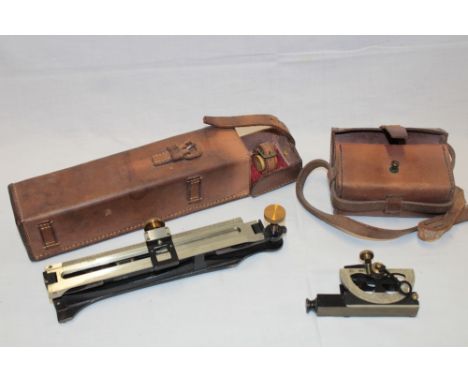 A painted metal and nickel mounted military sighting level dated 1938 in fitted leather case and a military clinometer marked