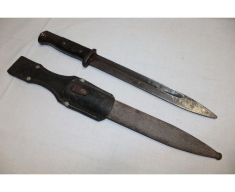 A Second War German Mauser bayonet with single edged blade in steel scabbard with leather frog (af)