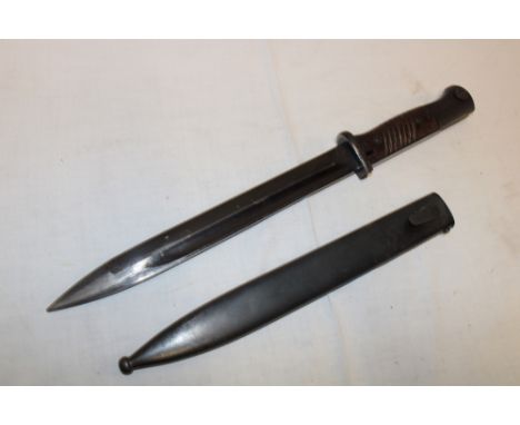 A Second War German K98 Mauser bayonet with 10" blackened steel blade marked "41 asw" in steel scabbard with matching numbers