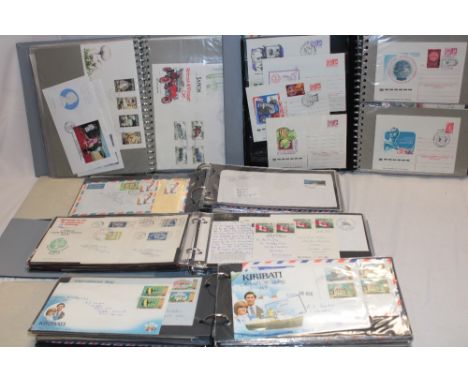 Five albums containing a selection of mixed World covers and first day covers including Tuvalu, Kiribati, Russia etc.