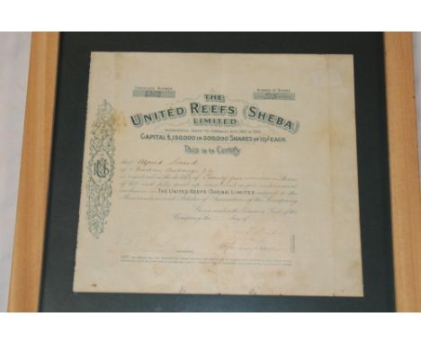An old share certificate for "The United Reefs (Sheba) Limited Company" for 25 shares, frames and glazed