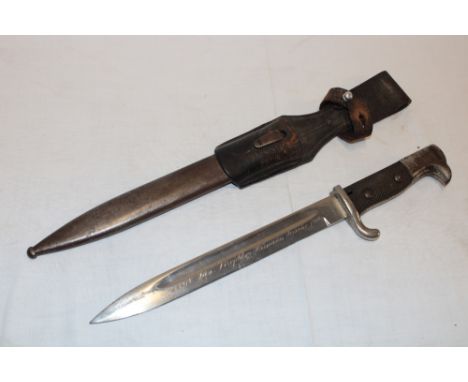 A Second War German Mauser bayonet with 10" steel blade etched "1914 San Virefeleen Hermann Terrake 1916" in steel scabbard w