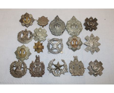 Seventeen various Scottish military cap badges including the Royal Scots, Highland Light Infantry, Cameron Highlanders, Argyl