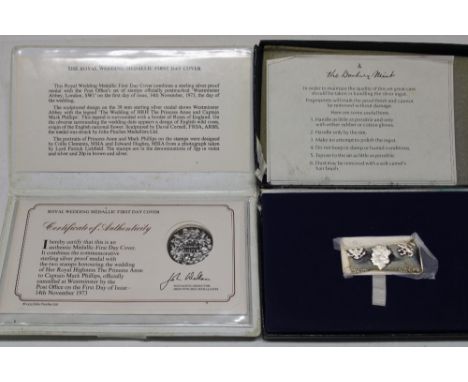 A Danbury Mint limited-edition silver ingot - July 1976, cased together with a John Pinches Royal Wedding 1973 silver medalli