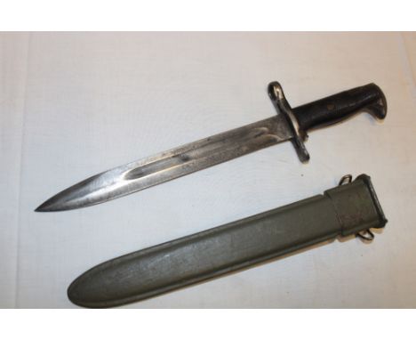 A Second War American M1 Garand bayonet with 9½" Bowie-point blade in composition scabbard