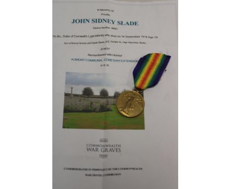 A First War victory medal awarded to No. 38991 Pte. J. Slade 7th Bn. DCLI - died 14.09.1918