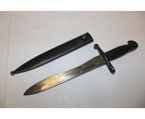 A Spanish Bolo bayonet with single-edged blade in steel scabbard, the hilt and scabbard with matching numbers