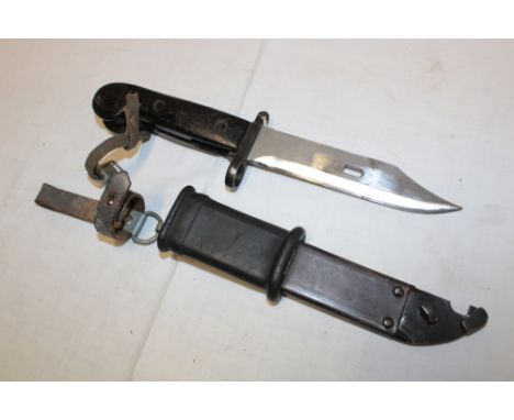 A Russian AK47 bayonet in composition scabbard with suspension straps