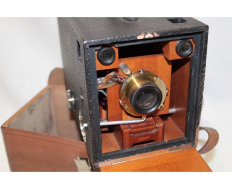 A Kodak Eastman "Bullseye" number 4 mahogany and brass mounted box camera circa. 1898-1904 with leather carrying case
