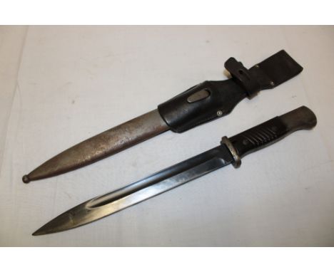 A Second War German K98 Mauser bayonet with single-edged blade by E. Pack in steel scabbard with leather frog