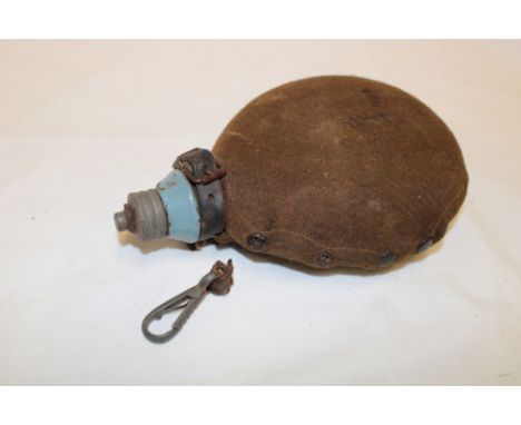 A First War German water canteen with original fabric cover