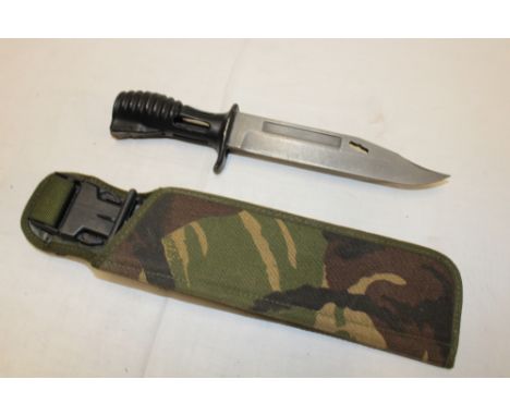 A British SA80 bayonet in camouflaged combat cover/scabbard dated 1994