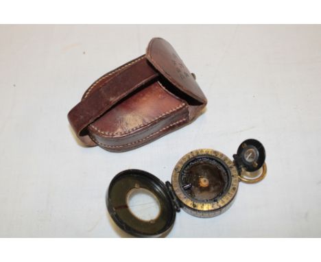 A First War Officer's marching compass by F. Barker & Son of London dated 1917, named to C. T. Stephens Machine Gun Corps in 