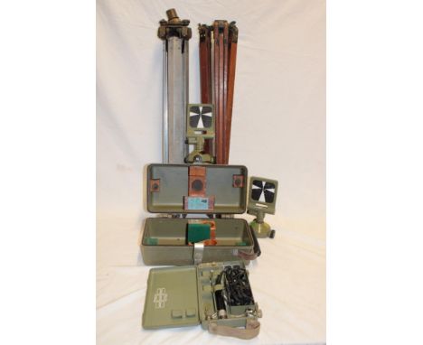 A selection of mine surveying accessories including aluminium and brass mounted folding tripod, wooden folding tripod, cased 