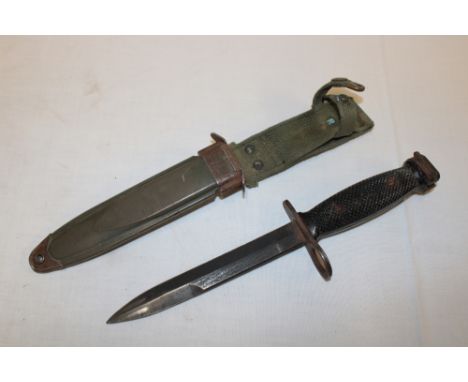 A United States M7 Vietnam era bayonet in composition scabbard marked "US M8A1 PWH"