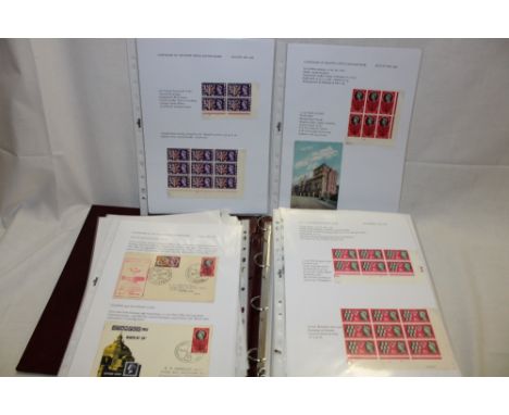 A folder album containing a collection of EIIR mainly unmounted mint stamps including commemoratives, control blocks, sheets 