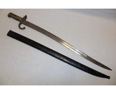 A 19th century French Chassepot bayonet with single-edged blade in steel scabbard with matching numbers