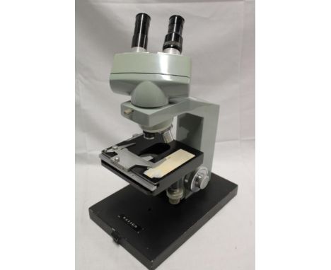 A binocular microscope by Watson on rectangular base