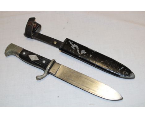 An unusual boy scout's dagger with single edged blade marked "Solingen" in painted steel scabbard