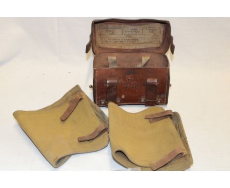 A First War German Medical Orderlies leather first aid case and two webbing puttees
