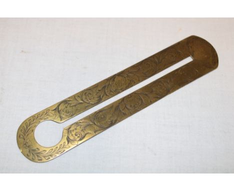 An unusual 19th century ornate brass military button cleaner engraved "826 E.B. 2 Battn. 24 Regt.", 8" long