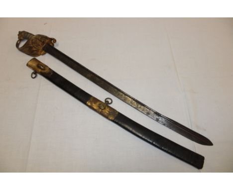 A Georgian Naval Officer's sword with shortened 23" pipe-backed blade in brass mounted part scabbard