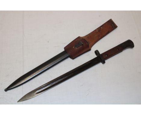 A Czech bayonet with blackened single-edged blade marked "CSZ1" in steel scabbard with leather frog