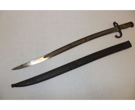 A 19th century French Chassepot bayonet with curved single-edged blade in steel scabbard