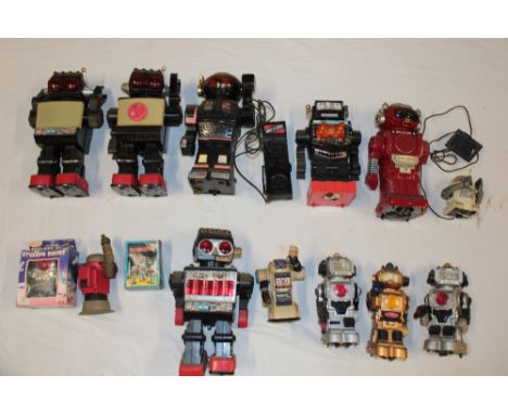 A selection of various robot toys and figures including numerous battery operated examples