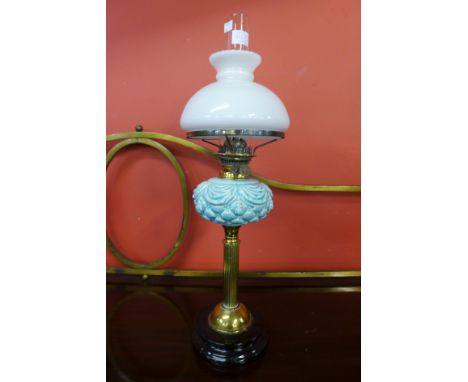 A Victorian brass and porcelain oil lamp 