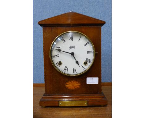 An early 20th Century inlaid mahogany mantel clock, 30cms h 