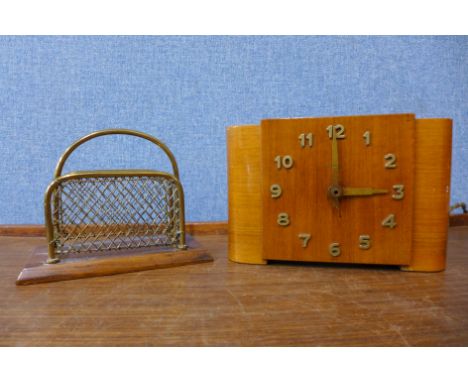 An Art Deco electric mantel clock and a letter rack 