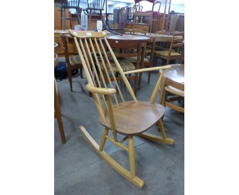 An Ercol Blonde elm and beech Goldsmith rocking chair 