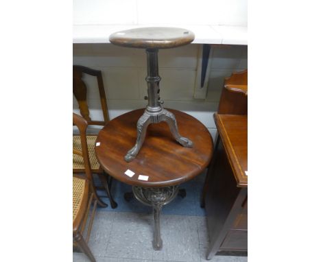 A cast steel based pub table and a revolving stool 