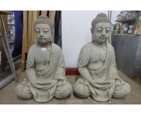 A pair of concrete garden figures of seated deities, 69cm h 