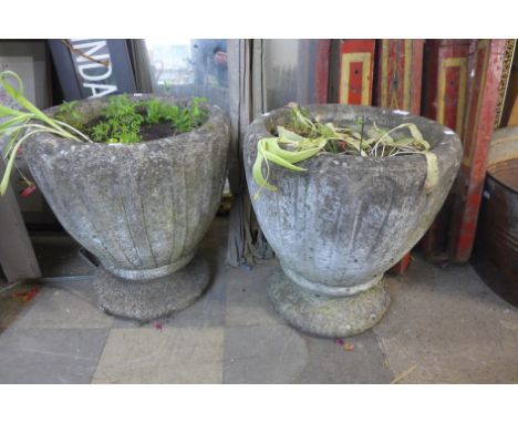 A pair of concrete garden planters 