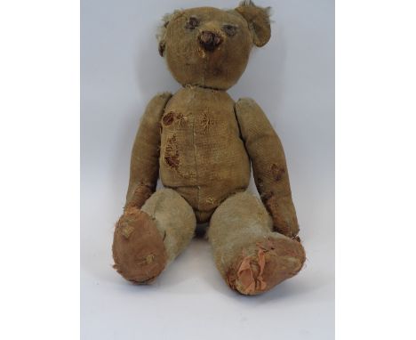 VINTAGE CHAD VALLEY TEDDY BEAR, Early 20th Century with metal part button in ear, in extremely loved and play worn condition 