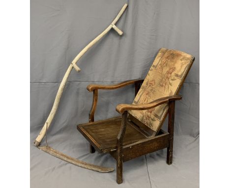 VINTAGE RECLINING ELBOW CHAIR - studded and upholstered back, 100cms H, 51cms W, 47cms D and an old scythe